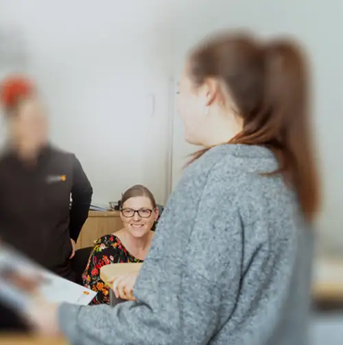 Woman receiving support at rehab center for recovery.