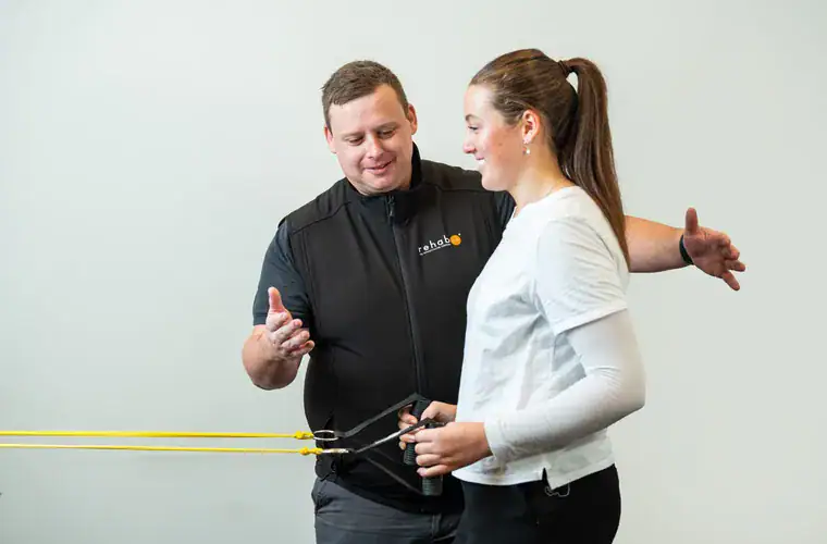 A RehabCo clinician leading a manual handling training session