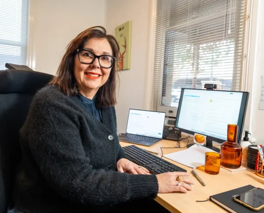 RehabCo consultant providing job seeking and resume support at a desk